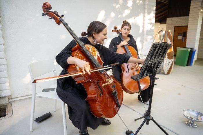 Desiree Sturrock and another cellist playing in the Museum of Art