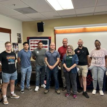 Students posing for a picture in the Veteran Resource Center