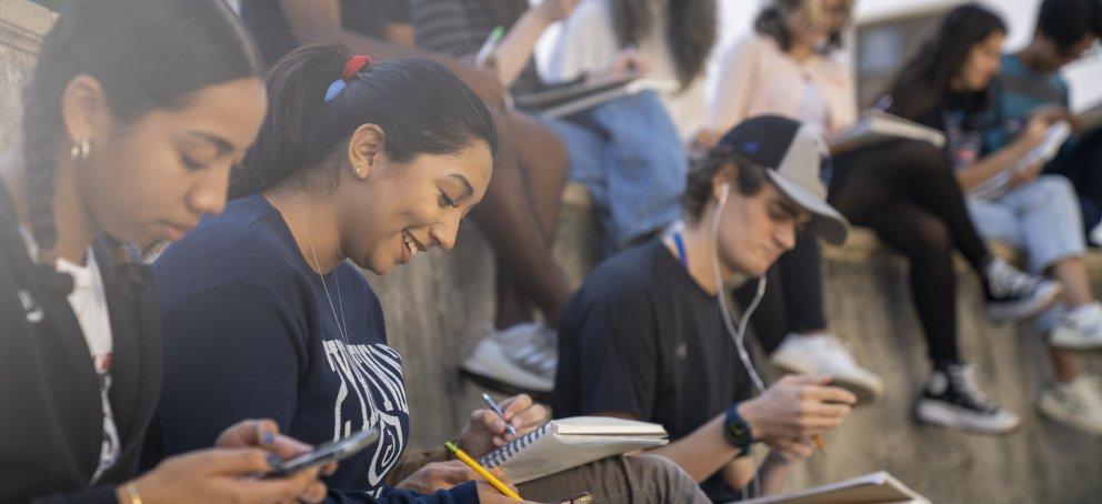 Student sitting in an a lecture class in outside