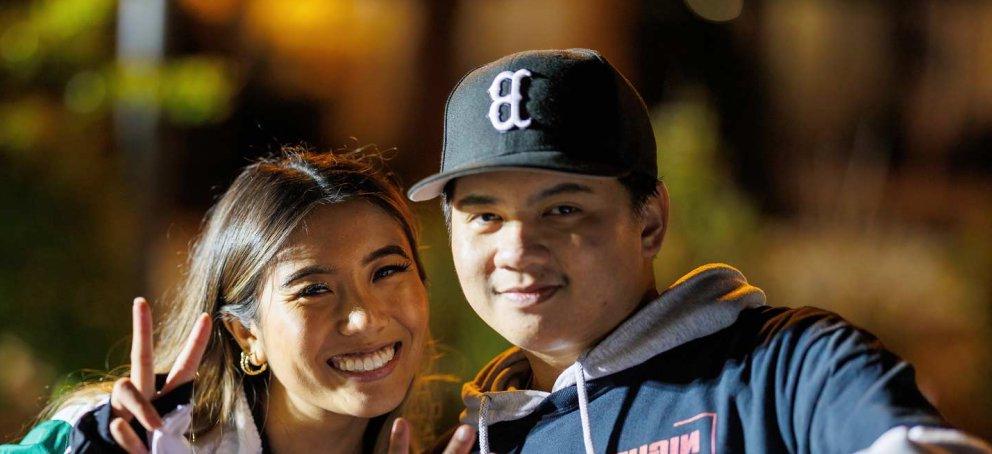 Students smiling at the night market